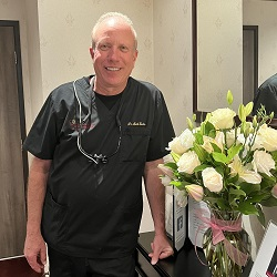 Mark D. Exler, D.D.S., F.A.C.P. Logo